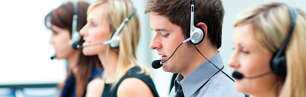 Psychosocial risks and stress. Several workers wearing telephone headsets